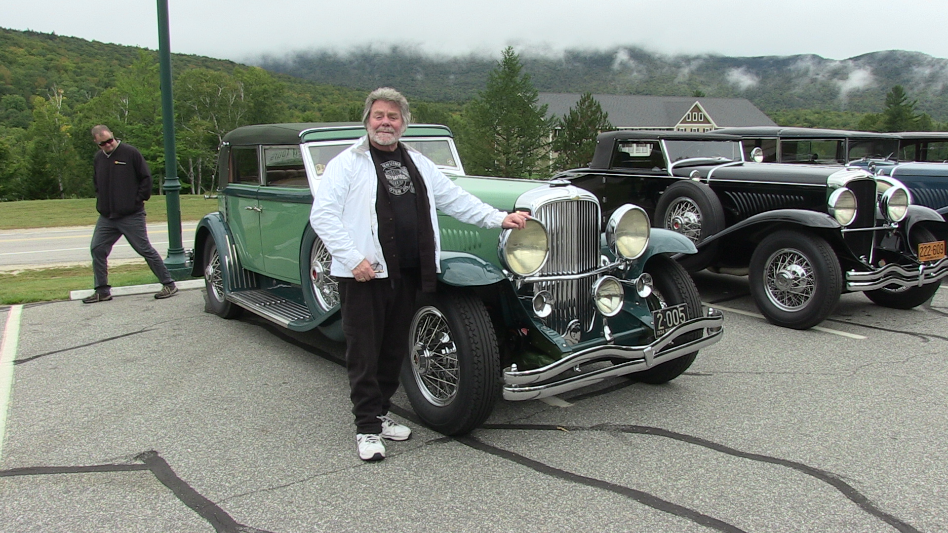 Dick Shappy posing with his 1934 Duesenberg J-505 by Derham